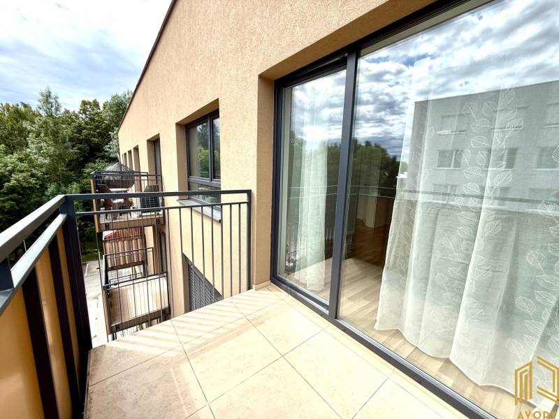 Balcony of a 2-room apartment in Senica on Sadova Street with a green view.
