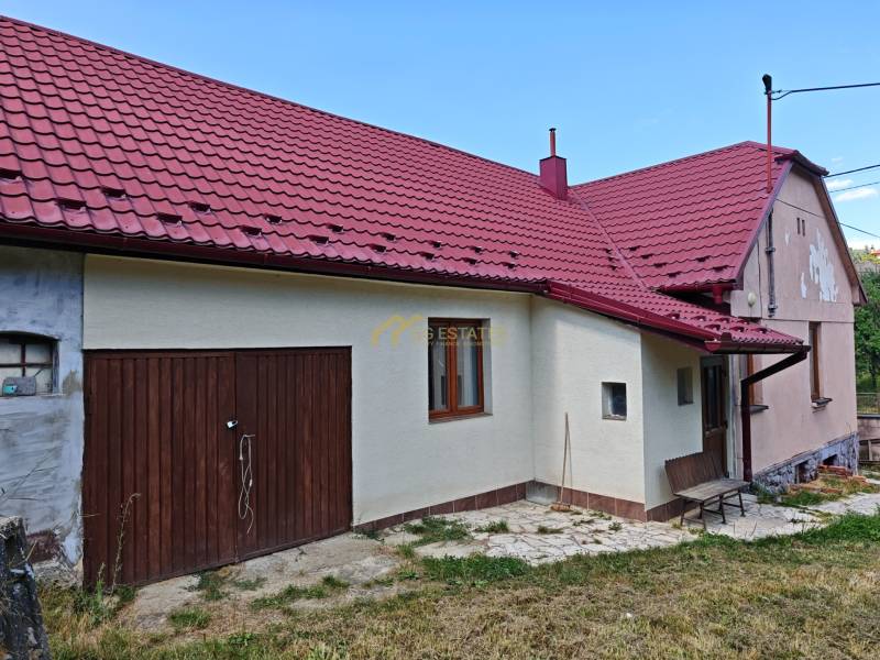 A family house on Dlha Street in Vranov nad Topľou with a red roof and two doors.