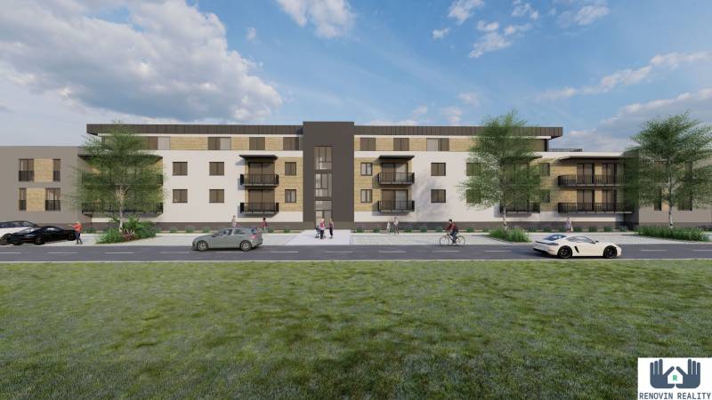 Construction of apartments in Kriváň with cars and pedestrians, surrounded by greenery.