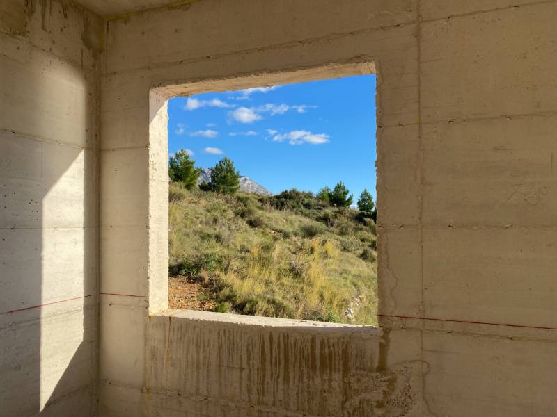 View from the unfinished Villa to nature with a blue sky.