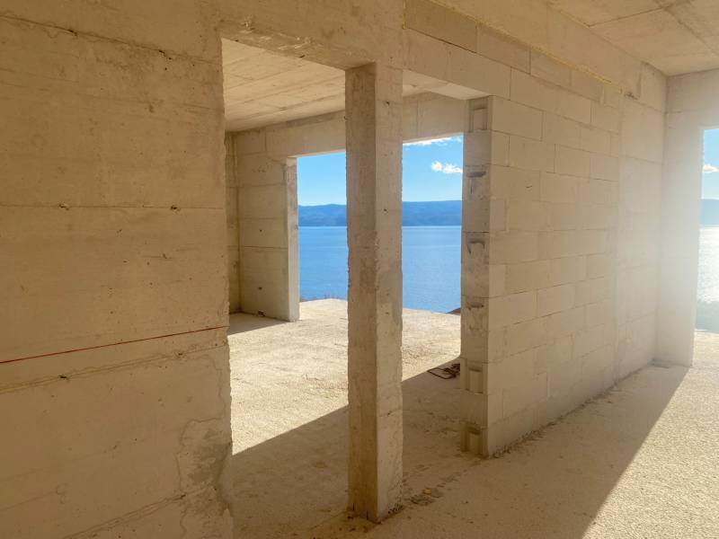 Unfinished spaces of a villa in Duće with a view of the sea and mountains.