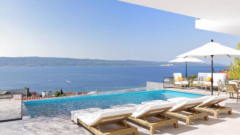 View from the villa in Duće of the sea, terrace with a pool, sunbeds, and umbrellas.