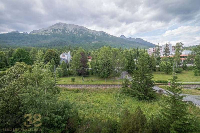 A view from a 3-room apartment in the High Tatras of majestic mountains and dense forests.