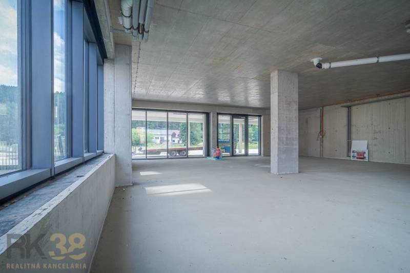 Unfurnished commercial spaces with glass doors, high ceilings, and a view to the exterior.