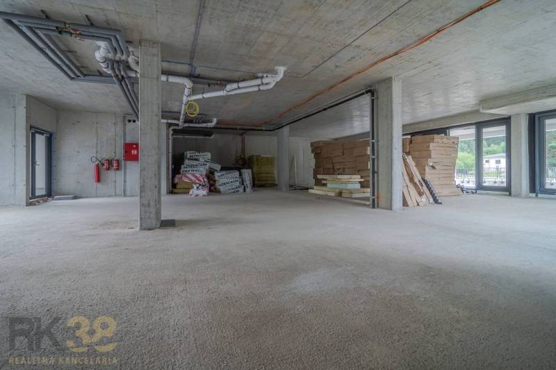 Future commercial premises with building materials and pipe installation in Svit.
