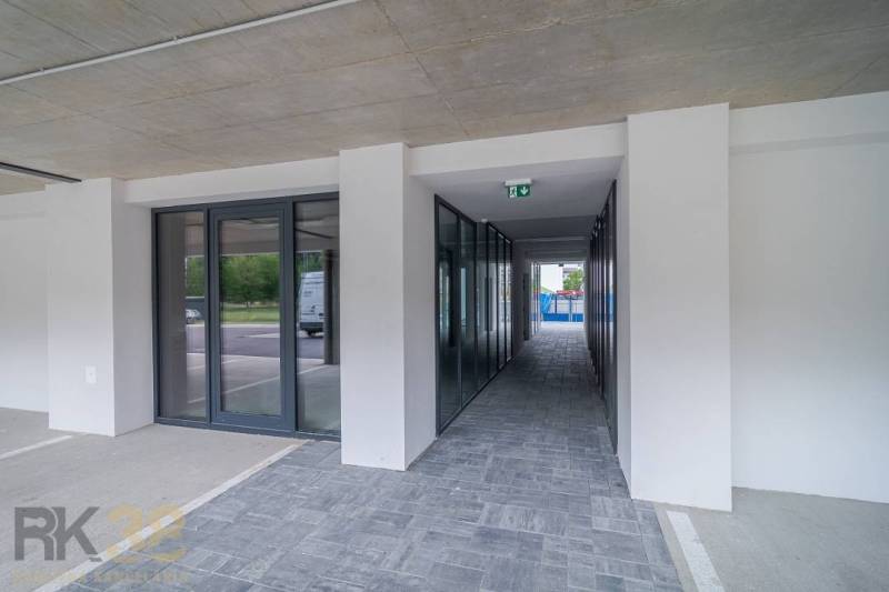 Commercial premises in Svit with glass doors and tiled floor next to a parking lot.