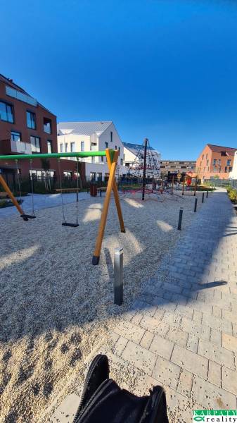Playground on Perlová Street in Bratislava - Jarovce, surrounded by multi-story buildings.