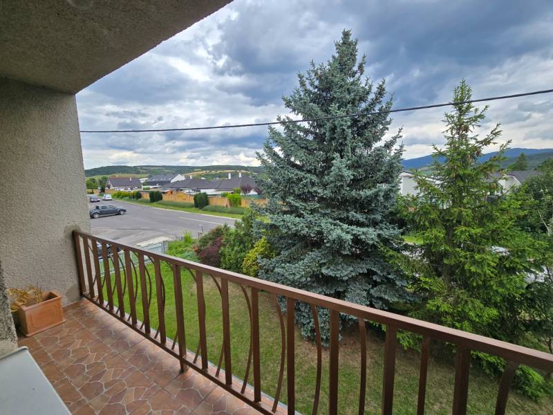 The view from the balcony of a family house in Nové Mesto nad Váhom overlooking the surroundings and greenery.