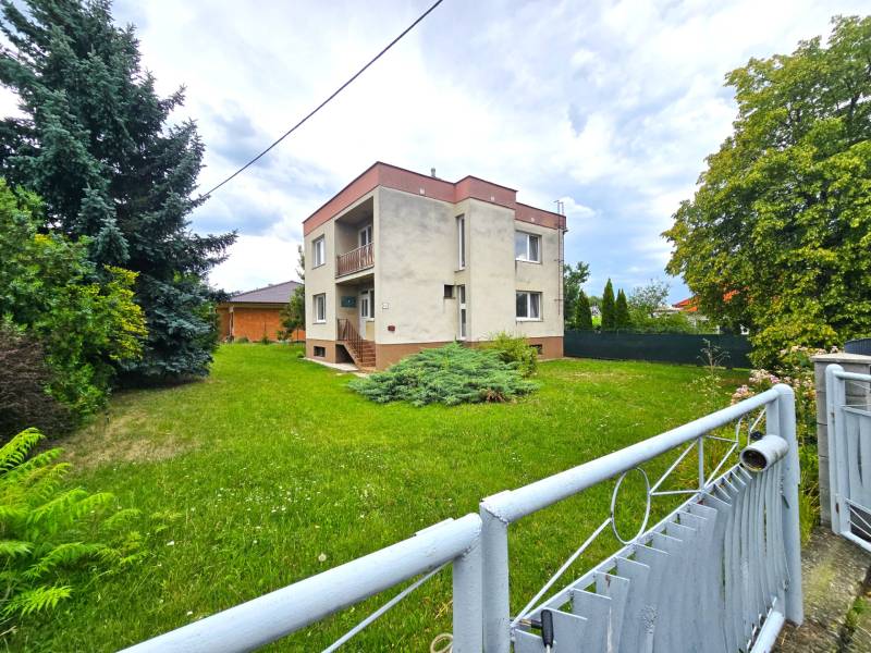 A family house in Nové Mesto nad Váhom, surrounded by a garden and greenery.