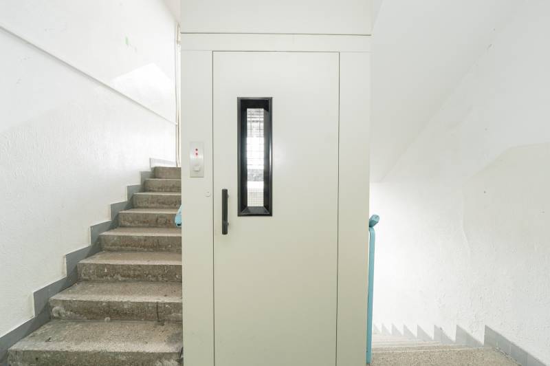 Staircase and elevator doors in an office building.
