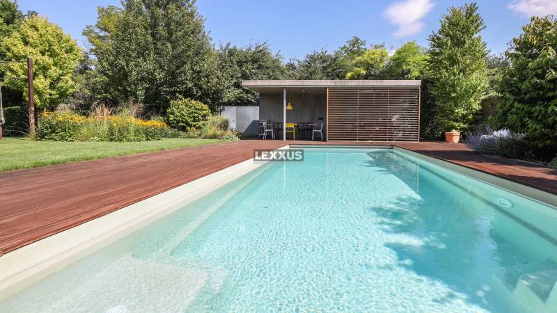 A family house with a swimming pool, garden, and terrace near Longobardská Street in Bratislava - Rusovce.