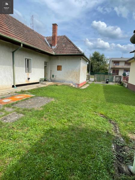 A family house in Trenčianske Stankovce with a well-maintained lawn and a traditional sloped roof.