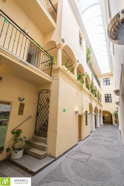 A bright passage with balconies and plants in offices on Michalská Street in Bratislava.