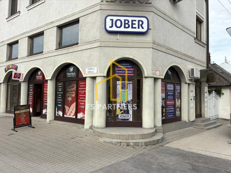 Komárno, Petőfi Street, commercial premises with advertising boards and multiple entrances.