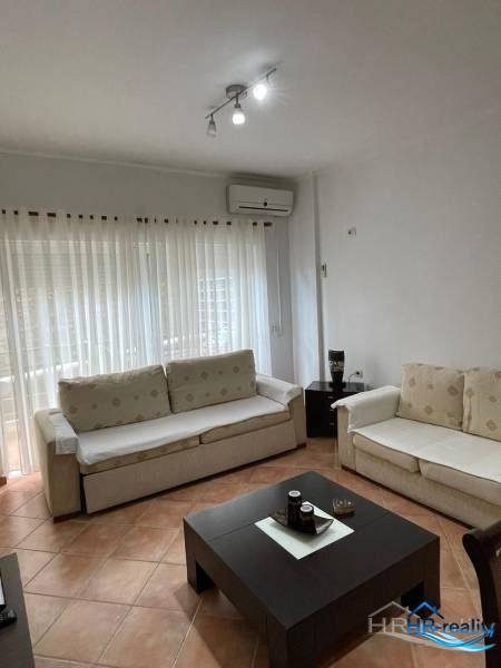 A comfortable living space with two sofas in a holiday apartment.