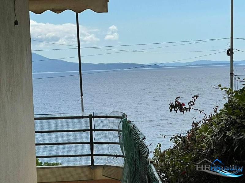 View from a holiday apartment in Saranda of the sea with mountains in the distance.