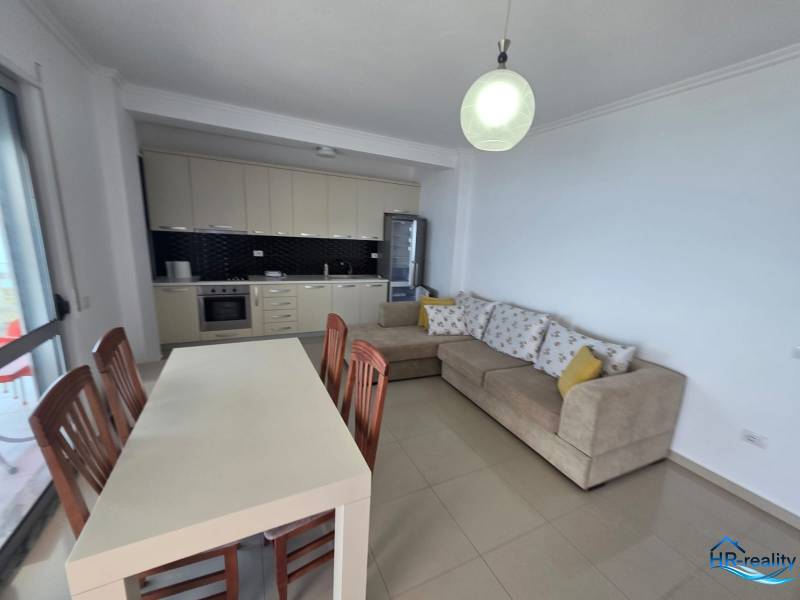 Spacious living room of the holiday apartment with a kitchenette and a comfortable corner sofa.