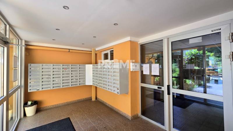 The entrance hall of an apartment building with mailboxes on Osuského Street in Bratislava - Petržalka.