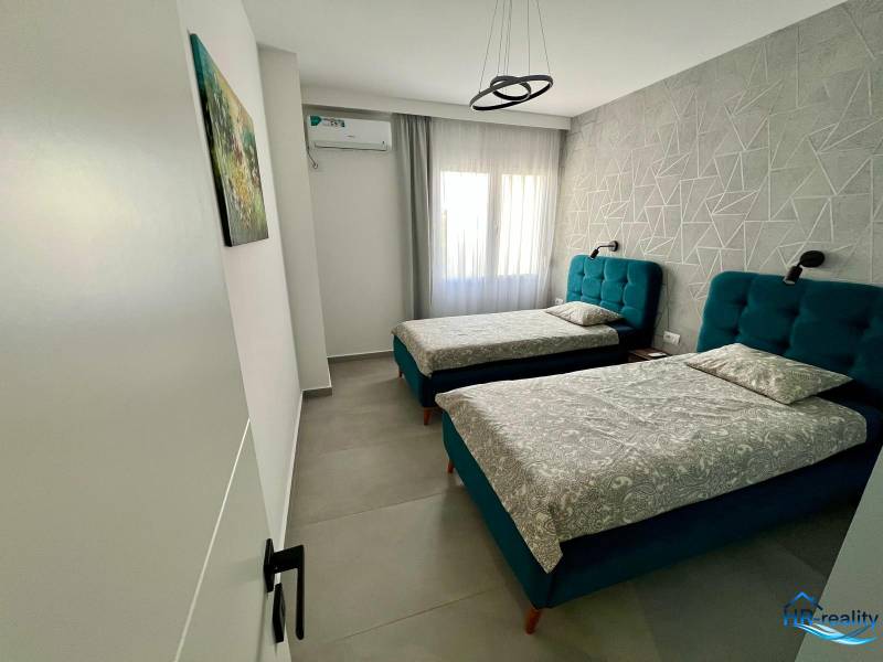 Double room with upholstered beds in the Holiday Apartment.
