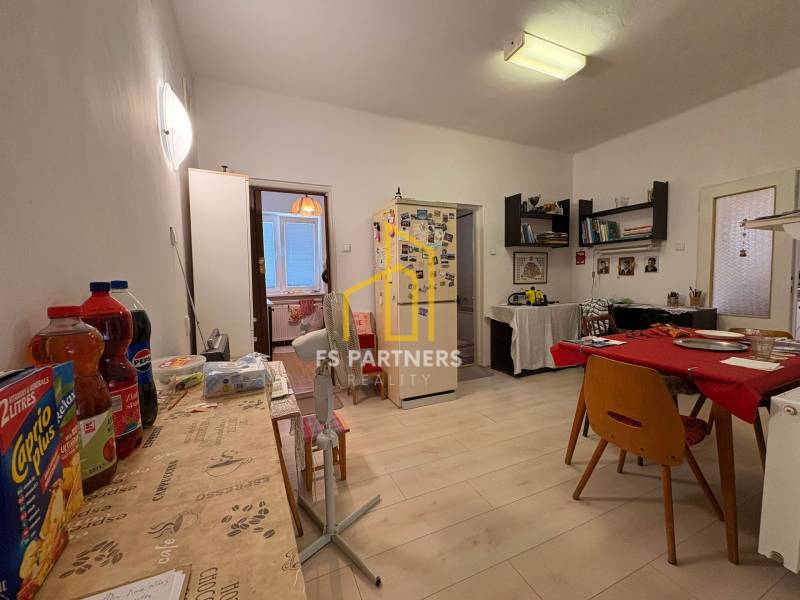 Dining room in a family house with furniture, table, and decorations.