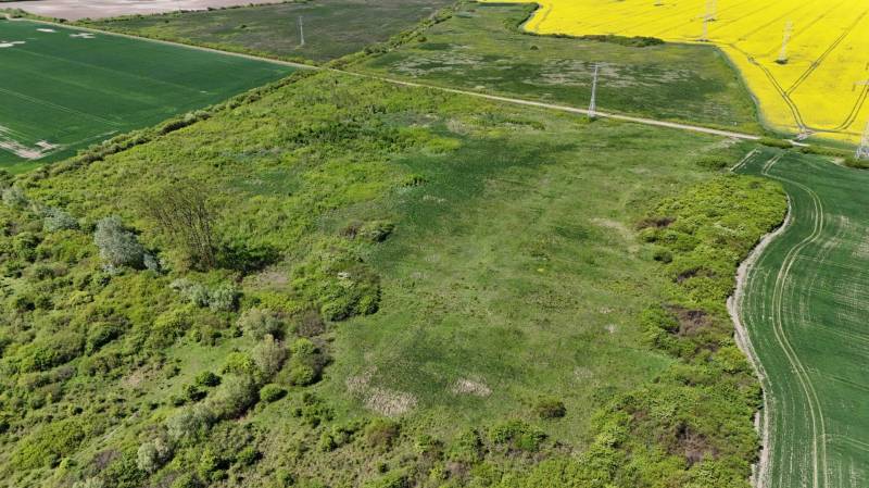 Aerial view of agricultural and forest land in Zemplínske Kopčany, predominantly with greenery.