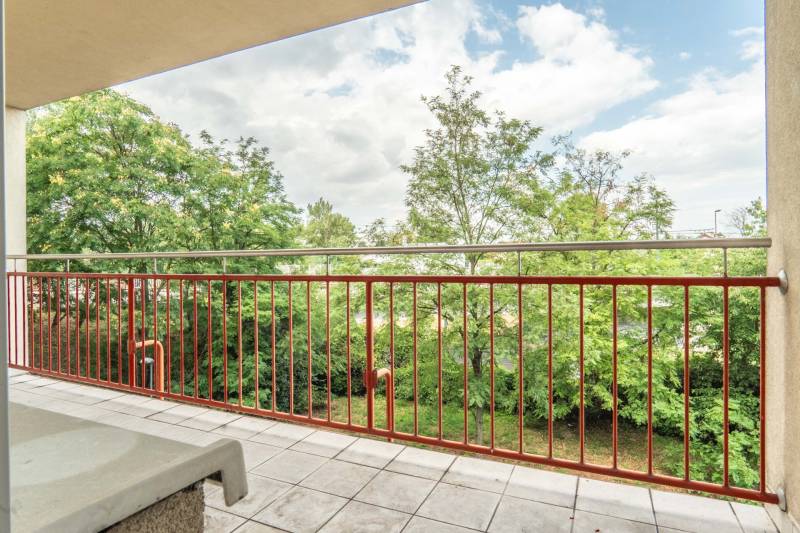 A balcony with a view of the green exterior in a 2-room apartment, Mierová Street, Bratislava - Ružinov.