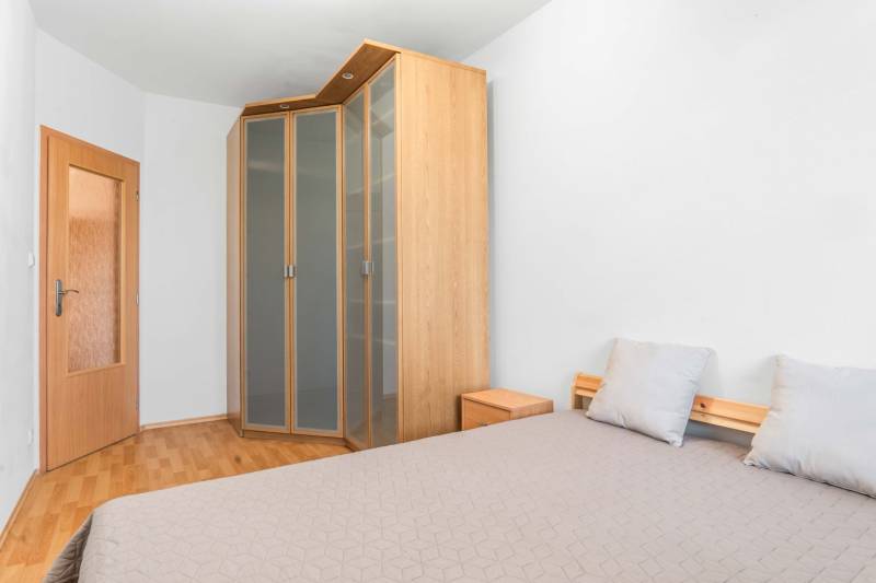 2-room apartment with a built-in wardrobe, bed, and nightstand.