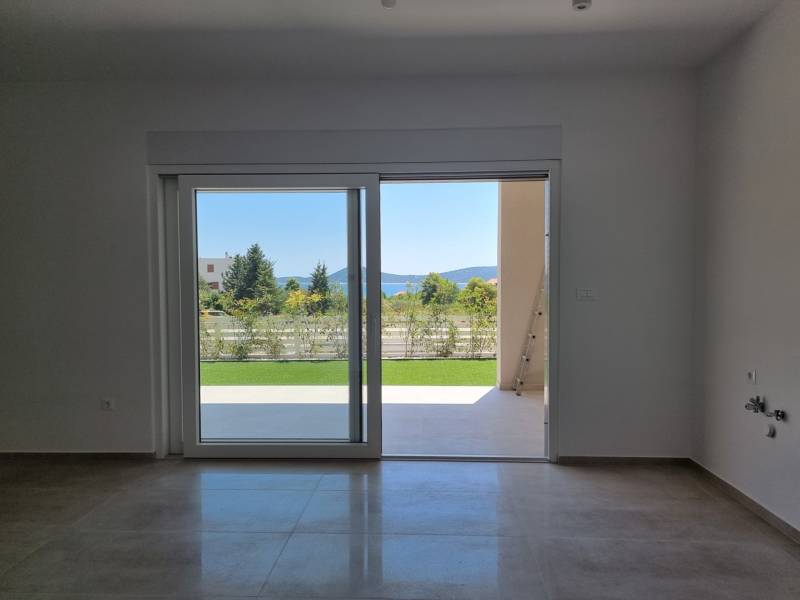 View from a 3-room apartment with a garden and sliding doors.