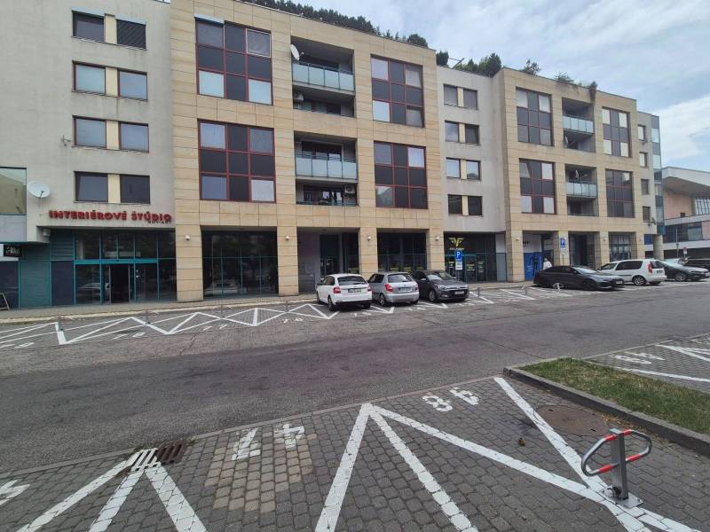 Commercial premises on Vajnorská Street in Bratislava - Nové Mesto with parked cars.