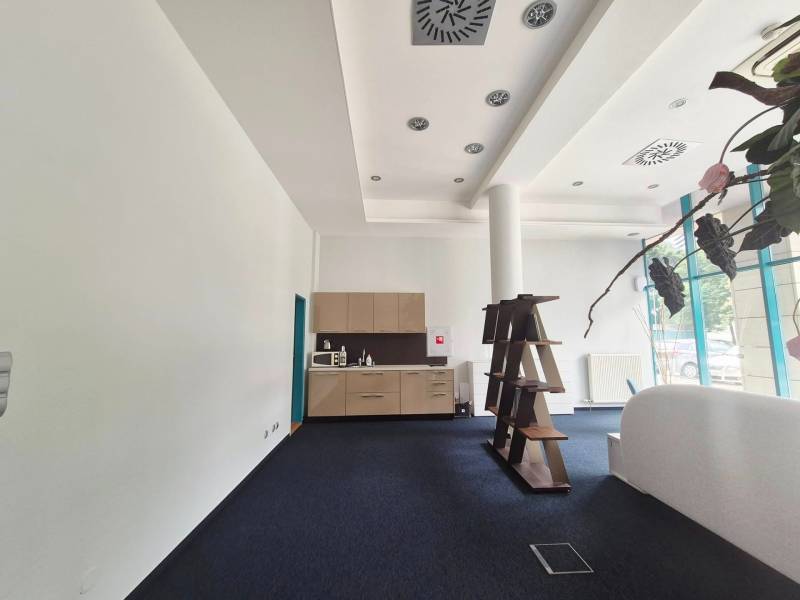 Interior of commercial premises with a kitchenette and a shelf in Bratislava.