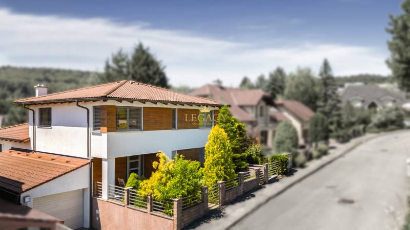 A family house on Malokarpatská Street in Limbach with a terrace and an ornamental garden.