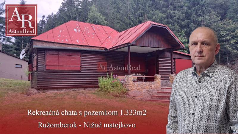A recreational cottage and surroundings in Ružomberok at Nižné Matejkovo, in front of a dense forest.