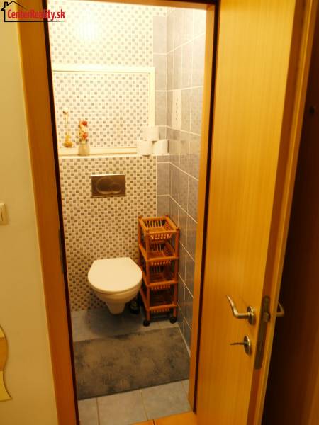 Bathroom with toilet and tiles in a 3-room apartment.