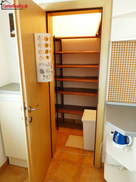 Compact storage space with built-in shelves in a 3-room apartment.