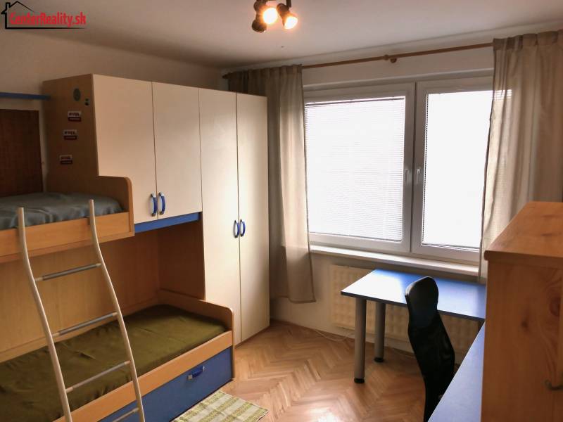 Children's room with a bunk bed and a desk in a 3-room apartment.