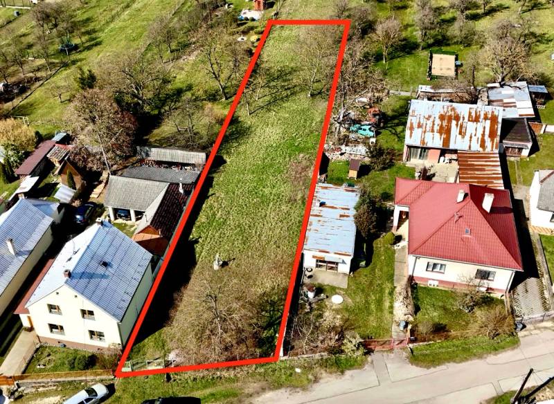 Building plot bordered by a red line in Moravské Lieskové, surrounded by houses.
