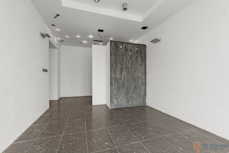 White walls and glossy tiles in commercial spaces, minimalist style and lighting.