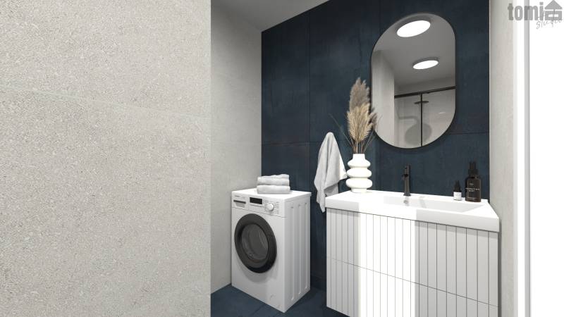 A bathroom in a 2-room apartment with a washing machine, sink, mirror, and decorative elements.