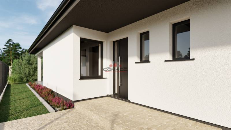 White facade family house on Pánska Niva street, green lawn, and clean sidewalk.