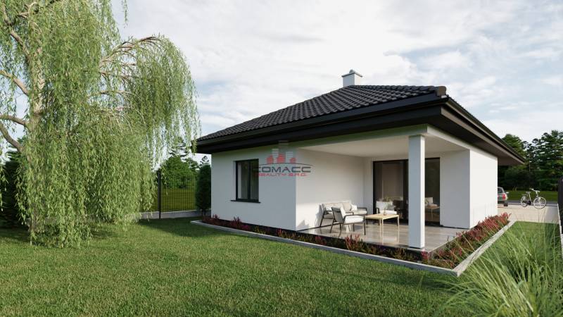 A family house with a terrace on Pánska Niva street, surrounded by green lawn and trees.