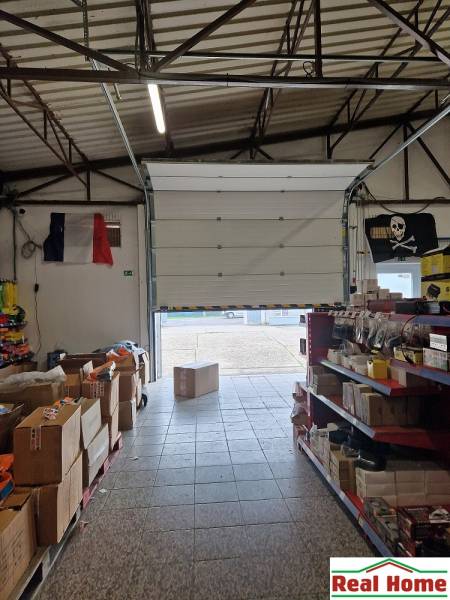 Šamorínská street, warehouses and halls full of goods with open warehouse doors.