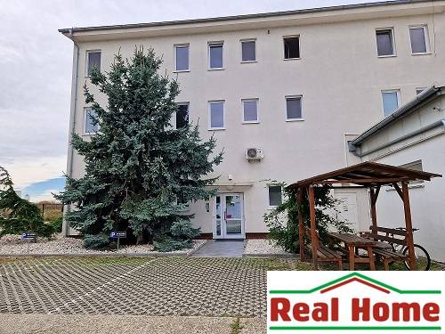 Building on Šamorínska Street with parking, connected with the Real Home office. Warehouses and halls.