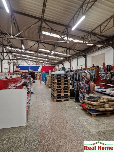 Warehouses and halls on Šamorínska Street, full of stored goods and pallets.