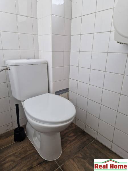 Bathroom on Šamorínska street with basic equipment and tiling, suitable for warehouses and halls.