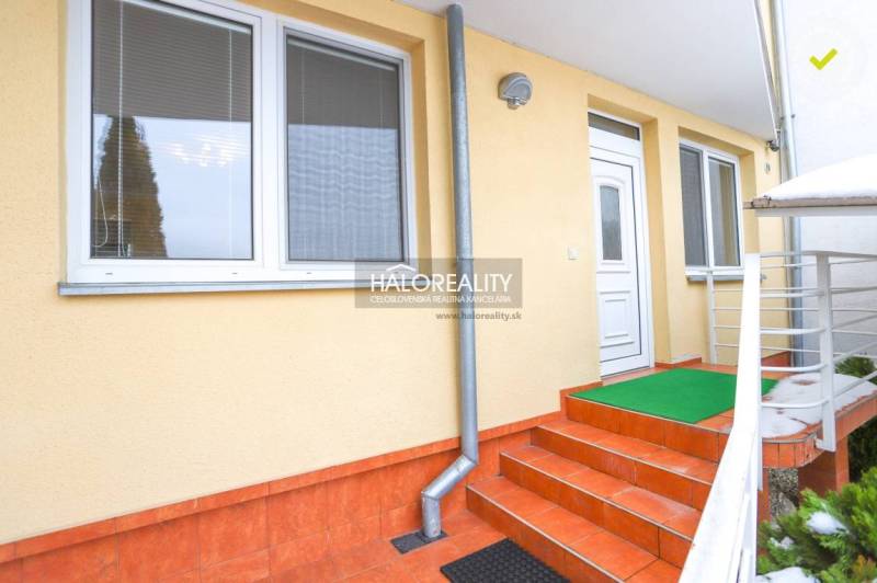 Entrance with red tiles to a 2-room apartment in Považská Bystrica.