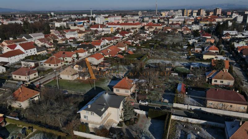 Panorama of villas in Topoľčany on Športovcov Street with red-roofed houses.