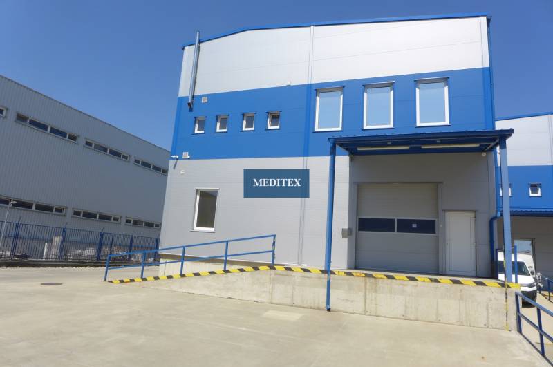 Warehouses and halls in Bratislava - Nové Mesto with blue and white panels and a ramp.
