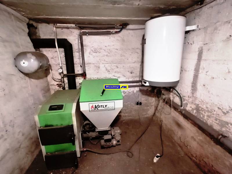 Boiler room with a solid fuel boiler in a family house.