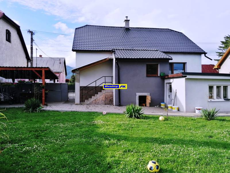 A family house in Sučany near Martin with a lawn and a shelter.