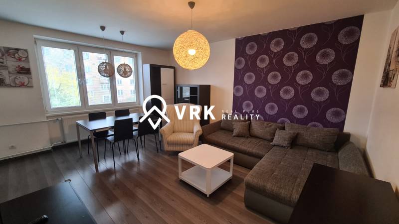 Elegant living room in a 2-room apartment with modern decor and comfortable seating.